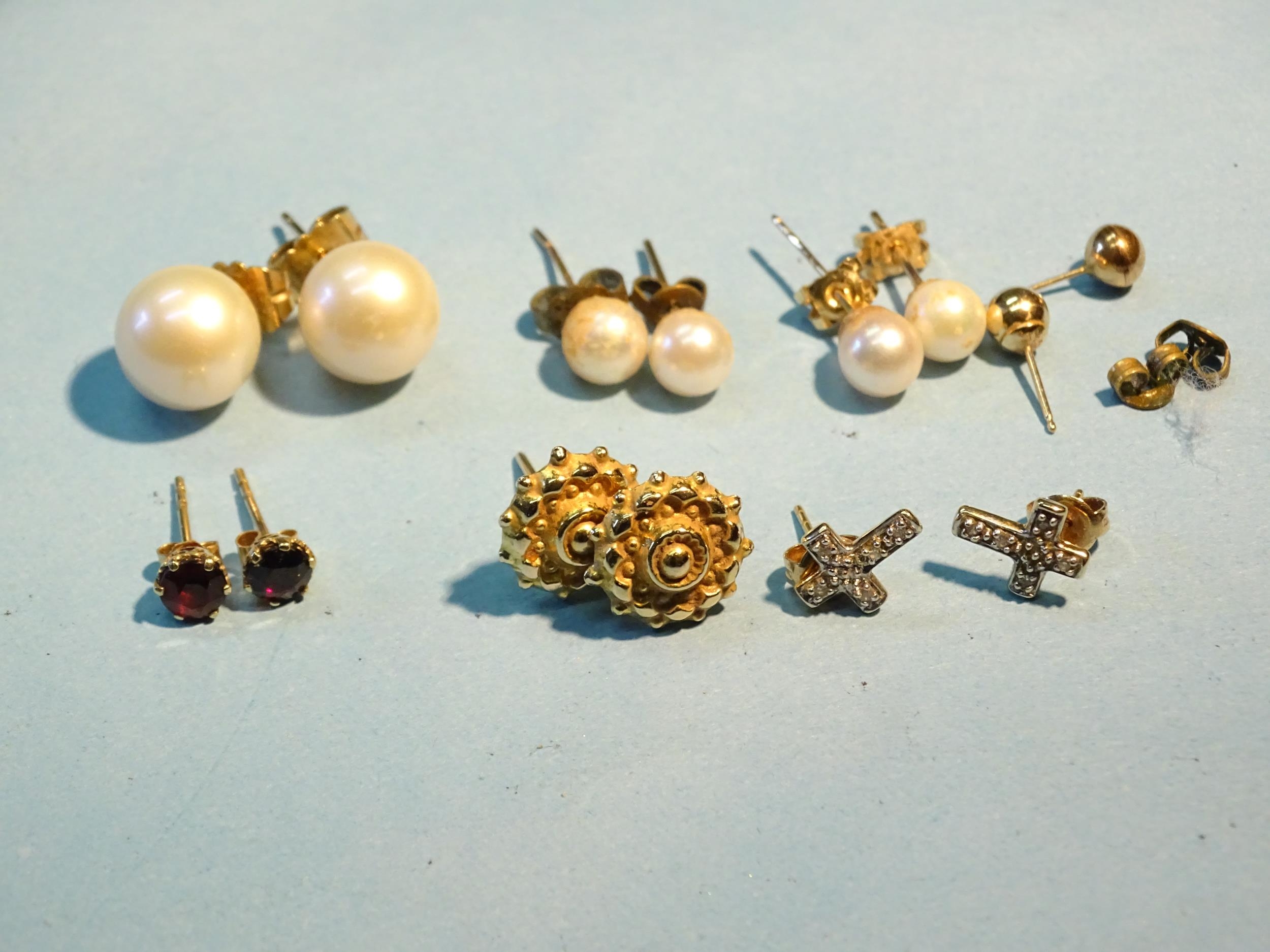 A pair of large cultured pearl ear studs...