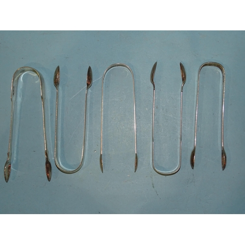 585 - Five pairs of Georgian plain silver sugar tongs, various dates, ___6oz.