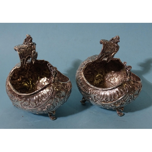 627 - A pair of Continental silver salts of bulbous boat shape, each raised on three scroll feet, London i... 