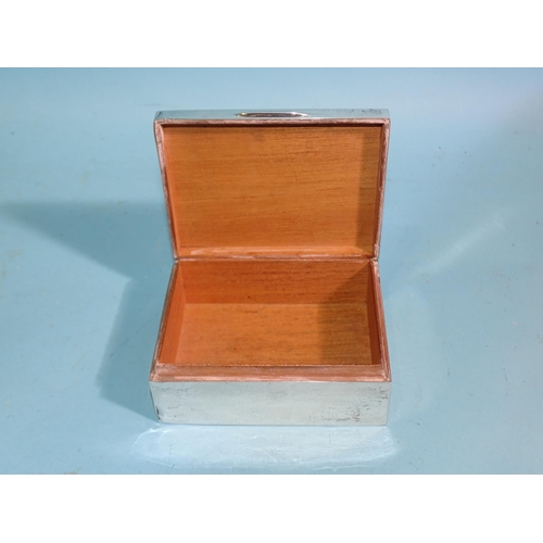 635 - An engine-turned rectangular cigarette box, Birmingham (marks rubbed), 11cm wide.