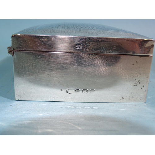 635 - An engine-turned rectangular cigarette box, Birmingham (marks rubbed), 11cm wide.