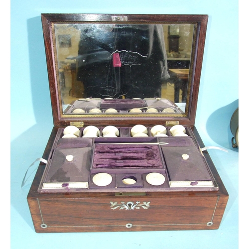 67 - An early-19th century rosewood and mother-of-pearl-inlaid sewing box, the fitted interior with some ... 