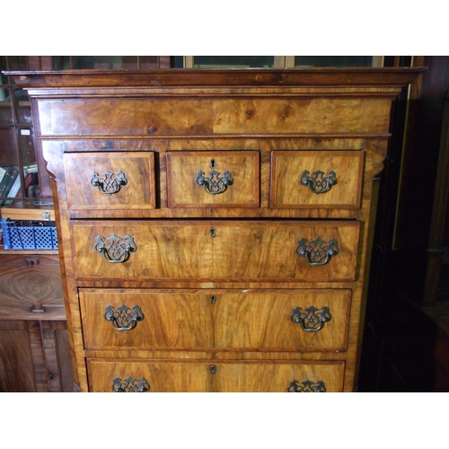 7 - A small walnut inlaid and banded chest on chest in the 18th century style, the cornice above three s... 