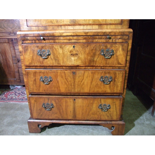 7 - A small walnut inlaid and banded chest on chest in the 18th century style, the cornice above three s... 