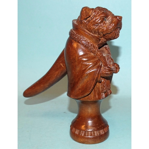 74 - An early-20th century Black Forest carved wood nutcracker in the form of a border terrier wearing a ... 