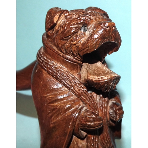 74 - An early-20th century Black Forest carved wood nutcracker in the form of a border terrier wearing a ... 