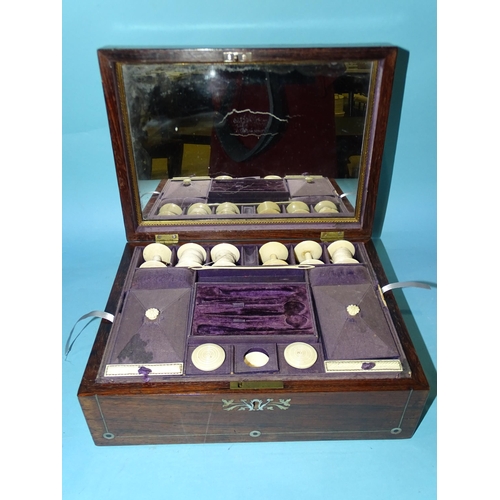 67 - An early-19th century rosewood and mother-of-pearl-inlaid sewing box, the fitted interior with some ... 