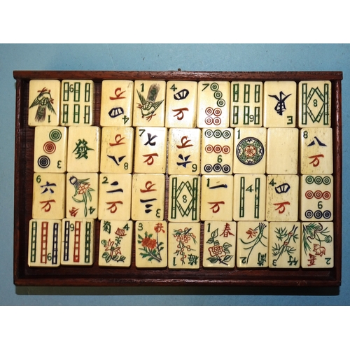 71 - A bone and bamboo Mah Jong set in metal-mounted wooden box, with separately-boxed wings.... 