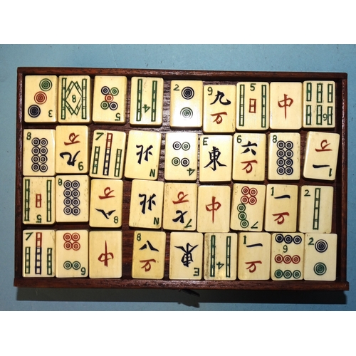 71 - A bone and bamboo Mah Jong set in metal-mounted wooden box, with separately-boxed wings.... 