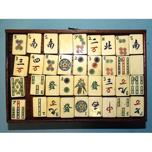 71 - A bone and bamboo Mah Jong set in metal-mounted wooden box, with separately-boxed wings.... 