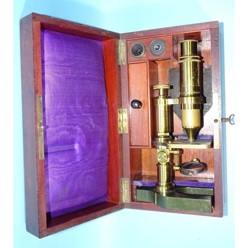 91 - A brass lacquered unnamed microscope on metal Y-shaped base, 25cm high, in fitted mahogany box.... 