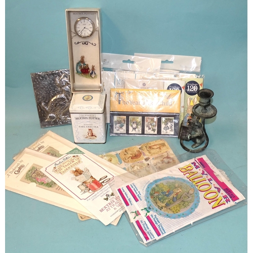 185 - A collection of modern Beatrix Potter memorabilia, including lapel badge, Royal Mint three Peter Rab... 