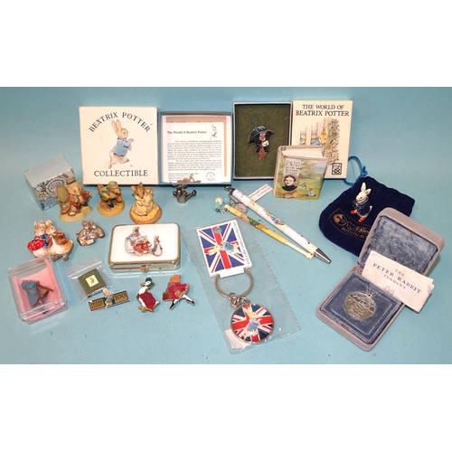 185 - A collection of modern Beatrix Potter memorabilia, including lapel badge, Royal Mint three Peter Rab... 