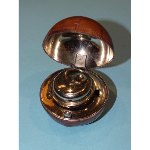 198 - A vintage leather cricket ball novelty inkwell, the hinged top opening to reveal a plated dome top a... 