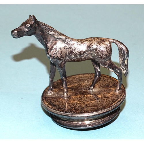 203 - A small plated car mascot in the form of a horse, 7.5cm high, base 6cm diameter.