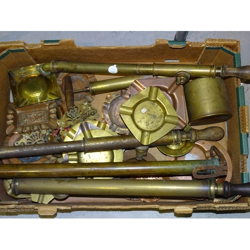 71 - A pair of brass covered iron door stops, a pair of brass trivets, a brass clockwork rotisserie/spit ... 