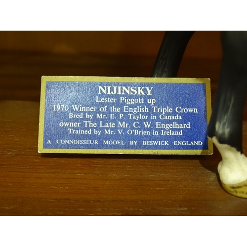 48 - A Beswick figure of 'Nijinsky - Lester Piggott Up', on wooden base, 32cm high, (reins a/f).... 