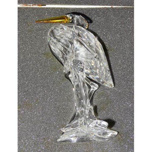 70 - A Swarovski crystal glass heron, (7670 000 001) and a tiger (7610 000 003), both in original boxes a... 