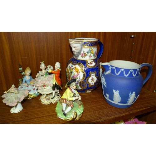 75 - A Wedgwood jasperware jug, 13cm high, various Continental figure groups and other mainly repaired or... 