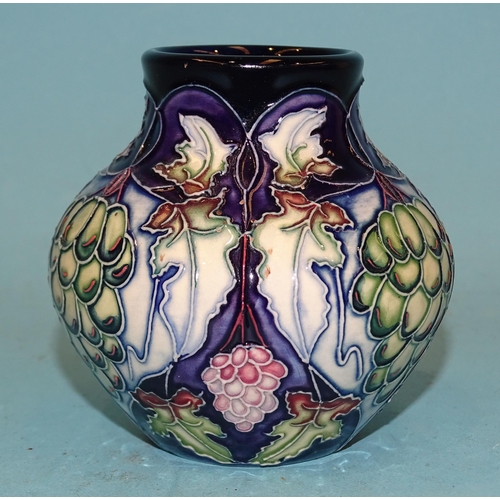 91 - A small modern Moorcroft ceramic pot of baluster shape, line-decorated with grapes and vines, painte... 