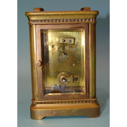 93 - A late-19th century French carriage timepiece, the foliate gilt dial with white chapter ring, 15cm, ... 