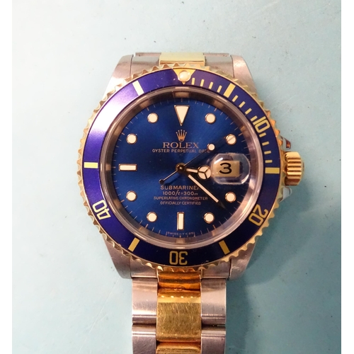 290 - Rolex, a bi-metal Submariner Oyster Perpetual Date bracelet wrist watch ref: 16613, the blue dial wi... 