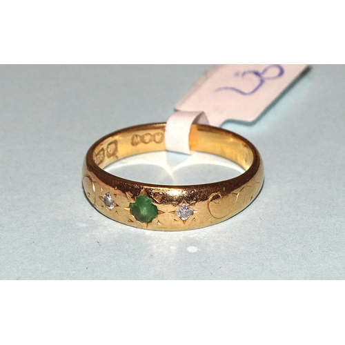 256 - A 22ct gold ring set two diamonds and a green paste stone, size M, 4.7g.