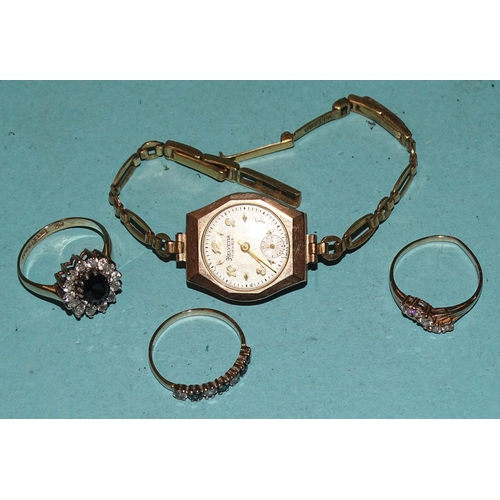 259 - Three 9ct gold gem-set rings, sizes L-M, 5.5g and a 9ct gold-cased wrist watch (a/f) on plated brace... 