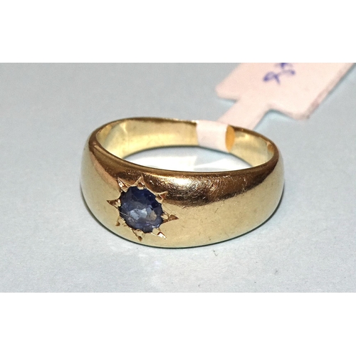 261 - A gold gypsy ring set a round-cut sapphire, unmarked, tested as 18ct gold approximately, size G, 5.2... 