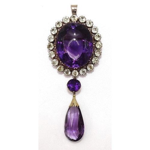 272 - A large Georgian/early-Victorian composed amethyst pendant, the oval cut amethyst with domed table f... 