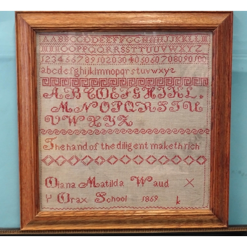 29 - A George IV sampler by Elizabeth Phillips aged 11, dated 1827, with verse within a surround of flora... 