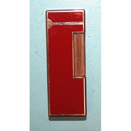 315 - A Dunhill gilt metal and red/brown Rollagas lighter, (boxed).