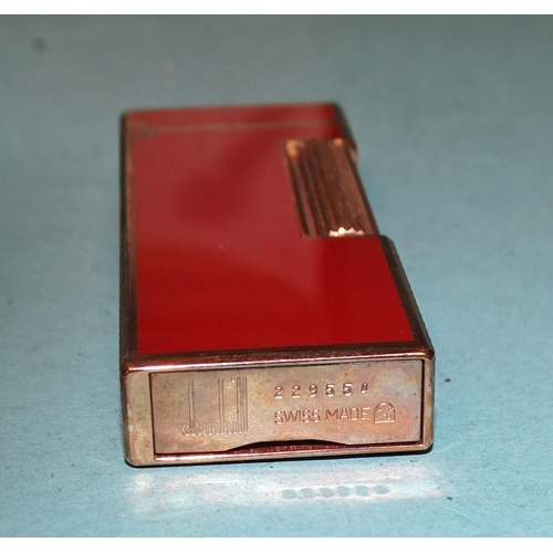 315 - A Dunhill gilt metal and red/brown Rollagas lighter, (boxed).