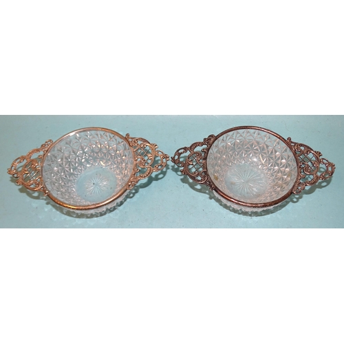 348 - A pair of small silver-mounted cut-glass dishes with pierced scroll and lattice handles, Horton &... 