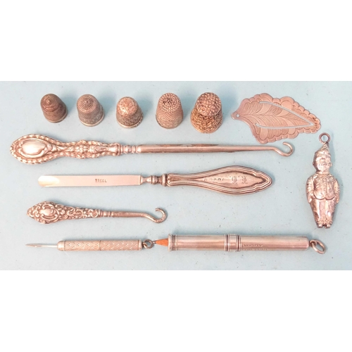 356 - A Sampson Mordan & Co. silver propelling pencil, (marks rubbed), a small Victorian silver rattle... 