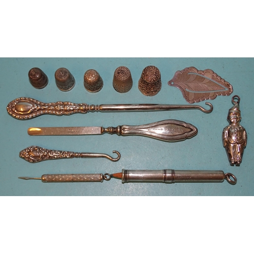 356 - A Sampson Mordan & Co. silver propelling pencil, (marks rubbed), a small Victorian silver rattle... 