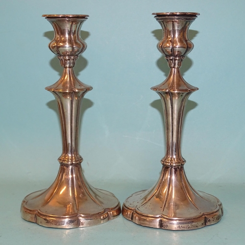 357 - A pair of Edwardian silver loaded candlesticks on flared lobed stems and bases, 22cm high, Walter La... 