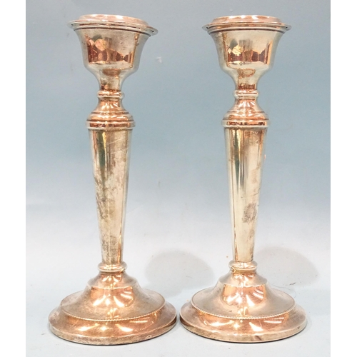 373 - A pair of modern silver candlesticks with loaded bases, 19cm high, Birmingham 1963.