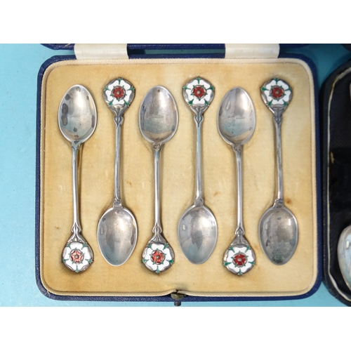 380 - A set of six silver coffee spoons with enamelled Tudor rose terminals by Mappin & Webb, Birmingh... 