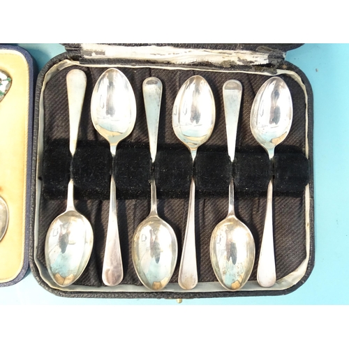 380 - A set of six silver coffee spoons with enamelled Tudor rose terminals by Mappin & Webb, Birmingh... 