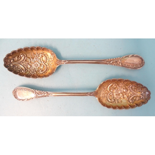 382 - A pair of Edwardian silver serving spoons with floral-embossed gilt bowls, Mappin & Webb, Sheffi... 