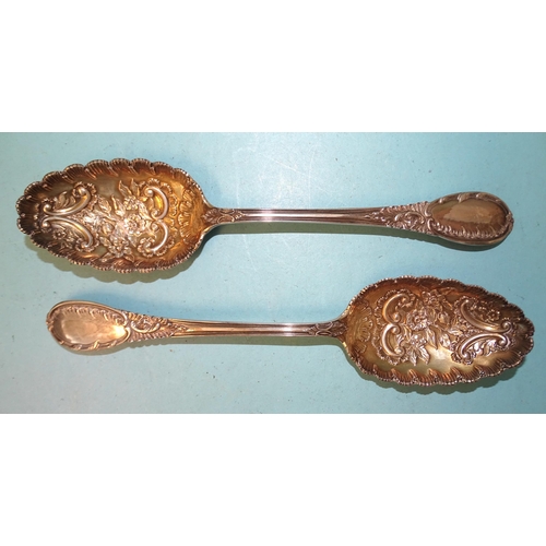 382 - A pair of Edwardian silver serving spoons with floral-embossed gilt bowls, Mappin & Webb, Sheffi... 