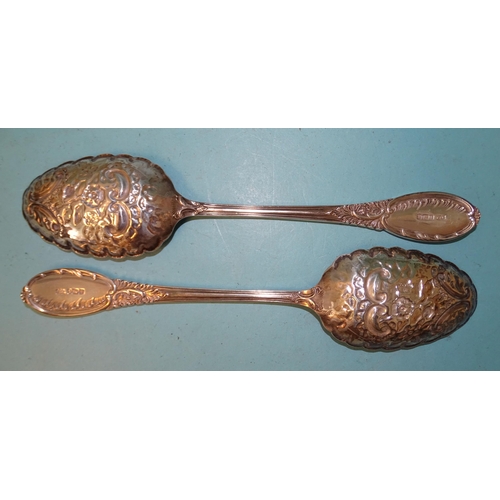 382 - A pair of Edwardian silver serving spoons with floral-embossed gilt bowls, Mappin & Webb, Sheffi... 