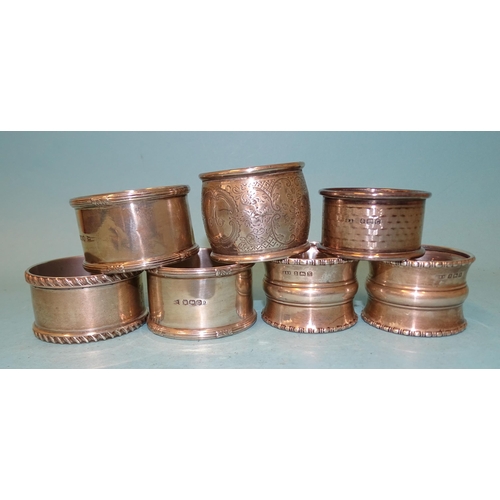 383 - Seven silver napkin rings, various dates and makers, ___5oz.