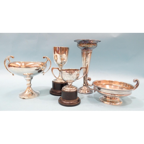 387 - Three various silver trophy cups, a small silver tazza, 6cm high and a silver spill vase with loaded... 