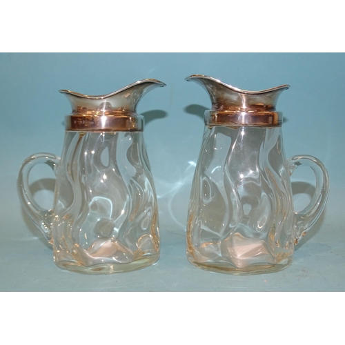 388 - A pair of George V silver-mounted glass whisky water jugs, 13.5cm high, Birmingham 1912, maker Porte... 