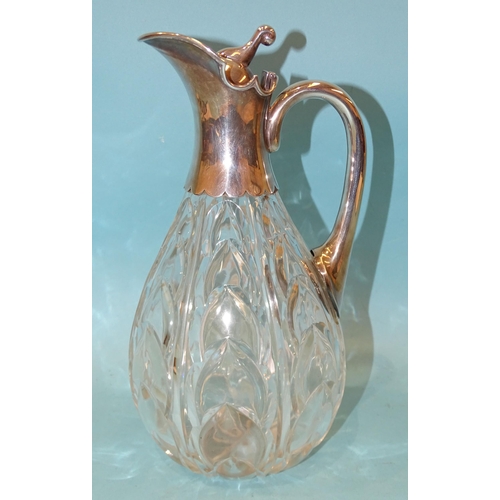 389 - A late-Victorian cut-glass and silver-mounted claret jug, the ovoid body with cut arabesques, the hi... 