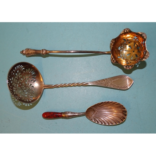 404 - A Victorian silver-gilt sifter spoon, Martin & Hall, Sheffield 1892, another with twisted stem, ... 