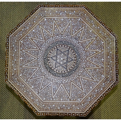 47 - An Anglo-Indian hardwood octagonal folding table inlaid overall with ivory, ebony and bone, the stan... 