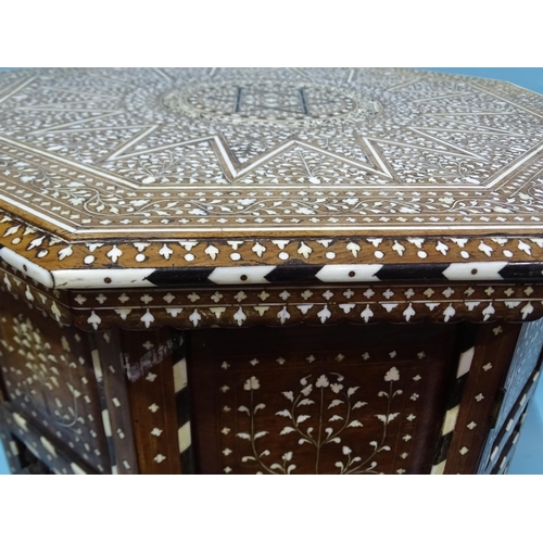 47 - An Anglo-Indian hardwood octagonal folding table inlaid overall with ivory, ebony and bone, the stan... 